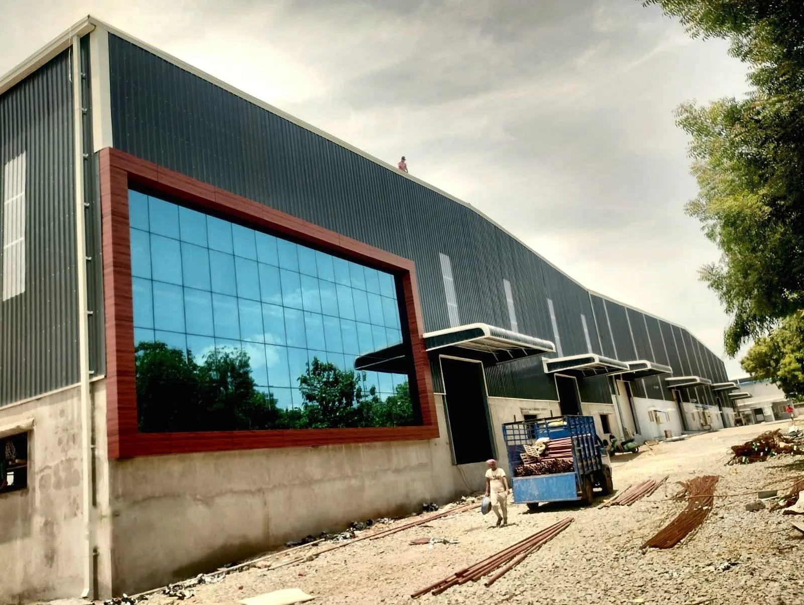 Industrial Building with Glass Facade — steel building by KVK PEB Solutions in Chennai, Tamil Nadu